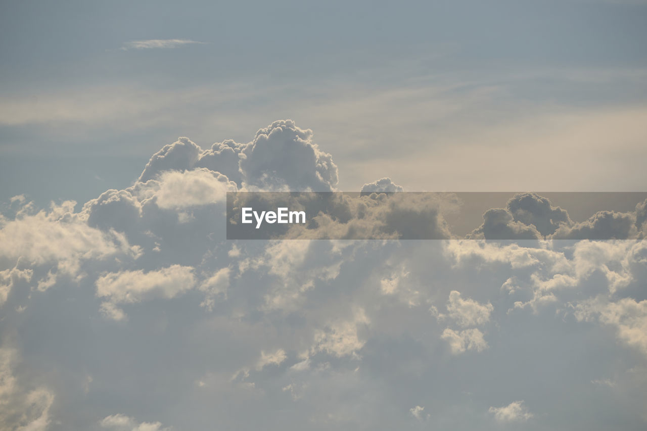 sky, cloud, beauty in nature, nature, sunlight, cloudscape, no people, environment, idyllic, tranquility, outdoors, scenics - nature, daytime, fluffy, day, horizon, flying, blue, dramatic sky, backgrounds, white, airplane, tranquil scene