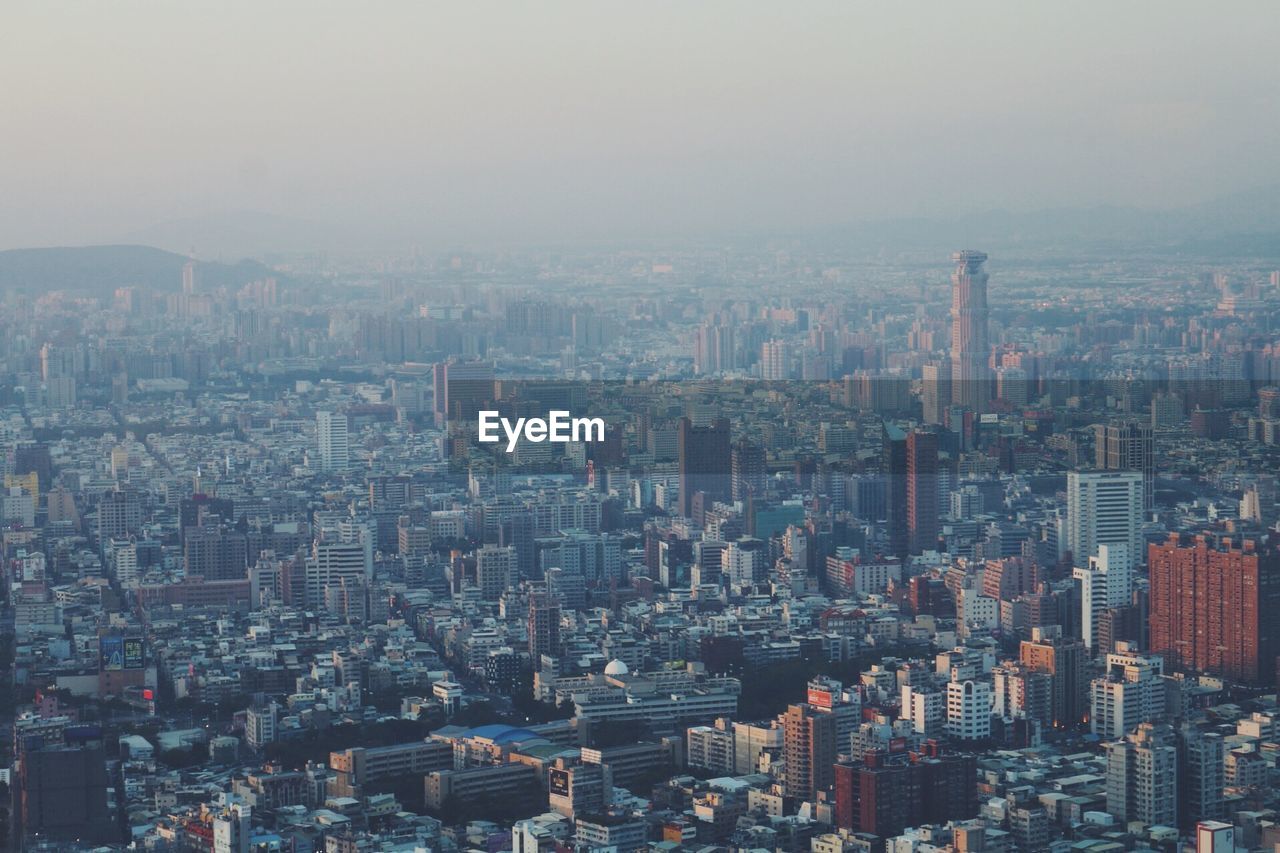 Aerial view of cityscape against sky