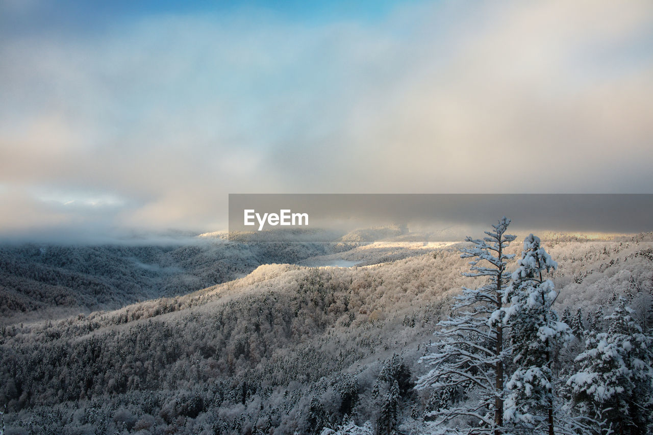 scenic view of snowcapped mountains against sky during sunset