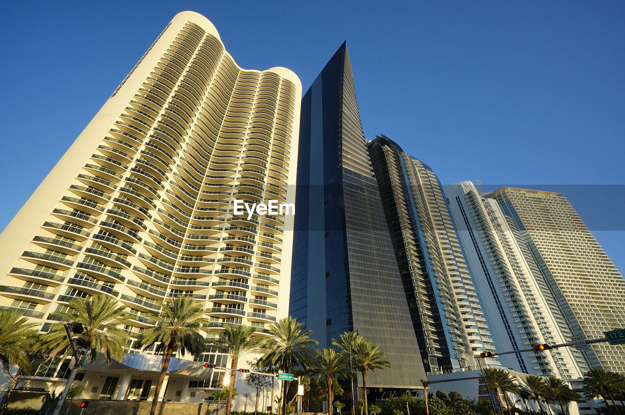 low angle view of modern buildings against clear sky
