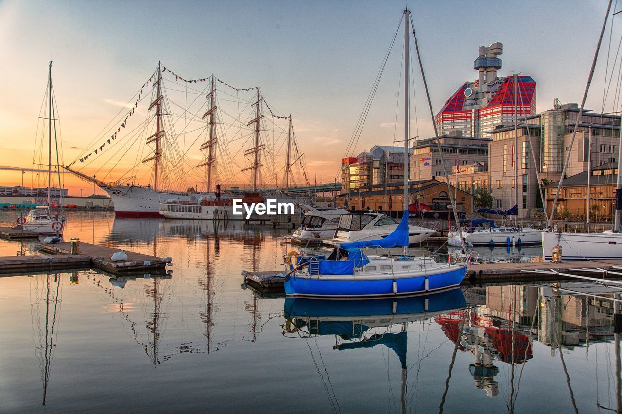 BOATS MOORED IN MARINA