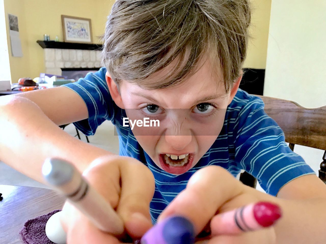 CLOSE-UP PORTRAIT OF BOY WITH HAND