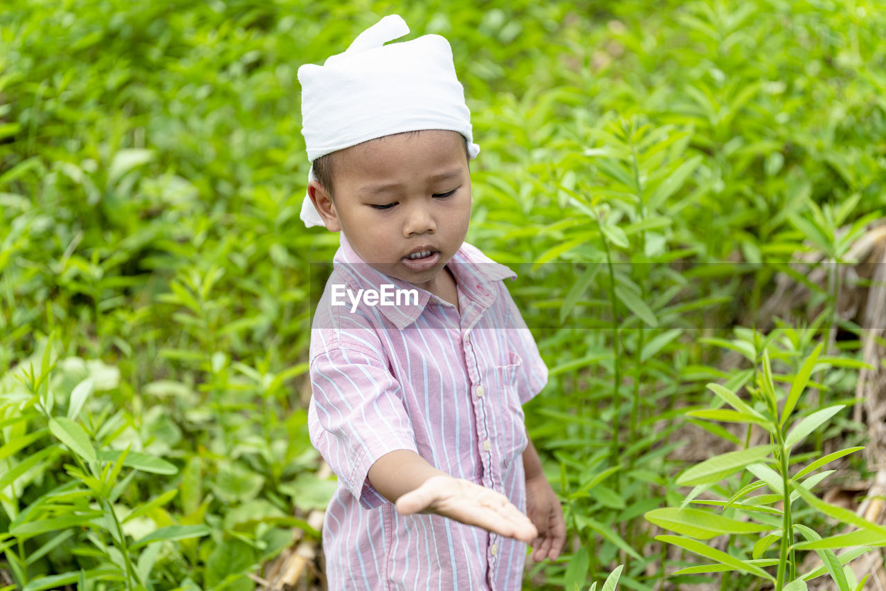 Boy standing on field