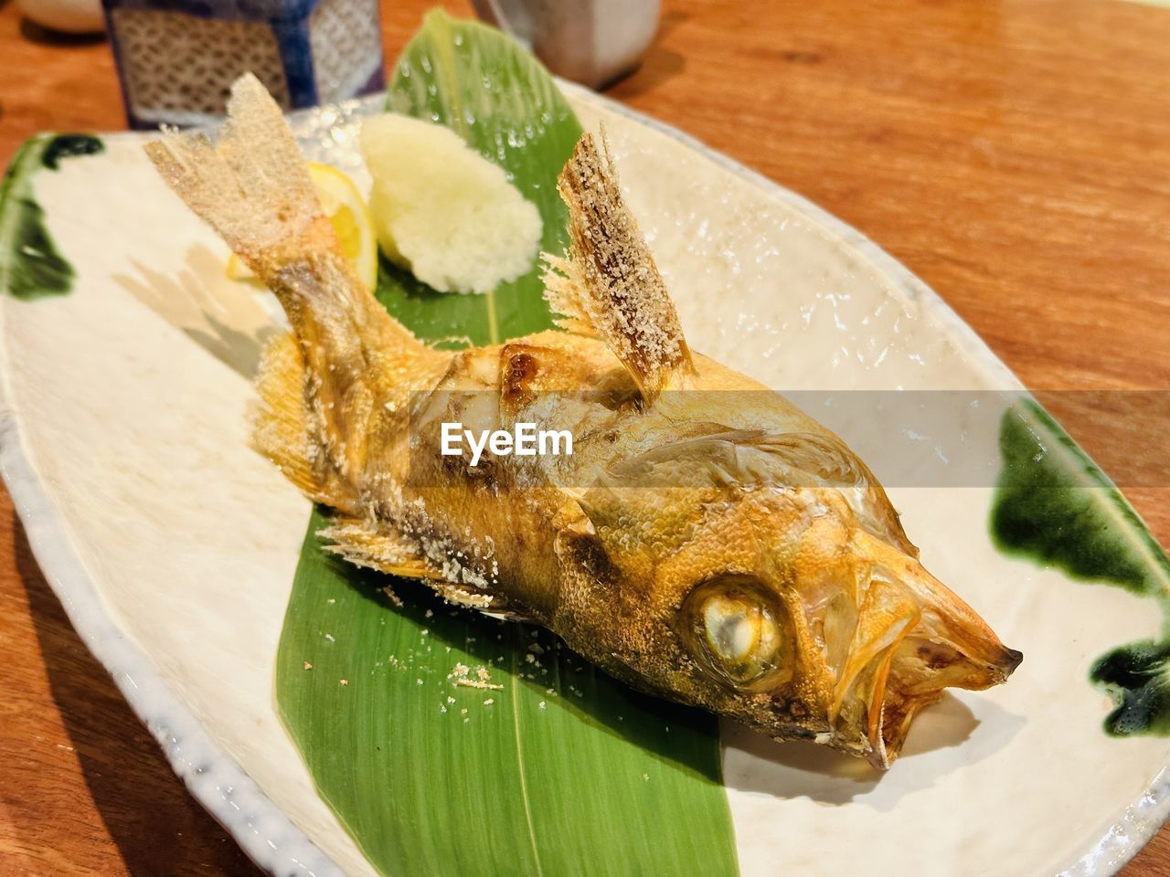 food and drink, food, fish, freshness, seafood, healthy eating, dish, wellbeing, table, cuisine, animal, indoors, no people, close-up, asian food, japanese food, plate, wood, leaf, high angle view, serving size, still life, plant part, sardine, produce, culture