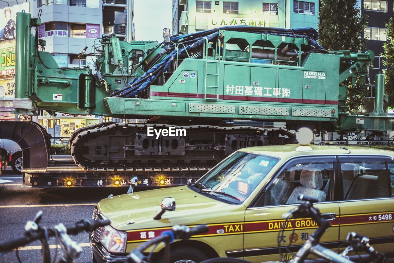 VEHICLES ON STREET IN CITY