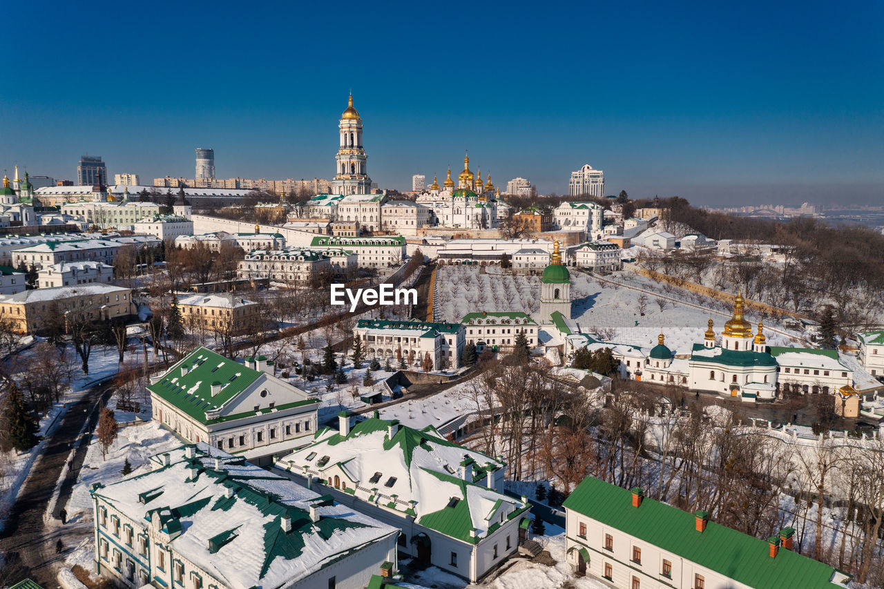 Beautiful winter top view of the kiev-pechersk lavra. many churches in the snow.