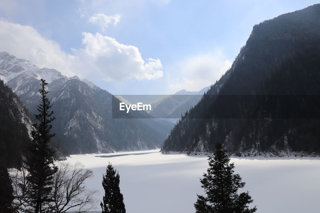 Scenic view of snowcapped mountains against sky