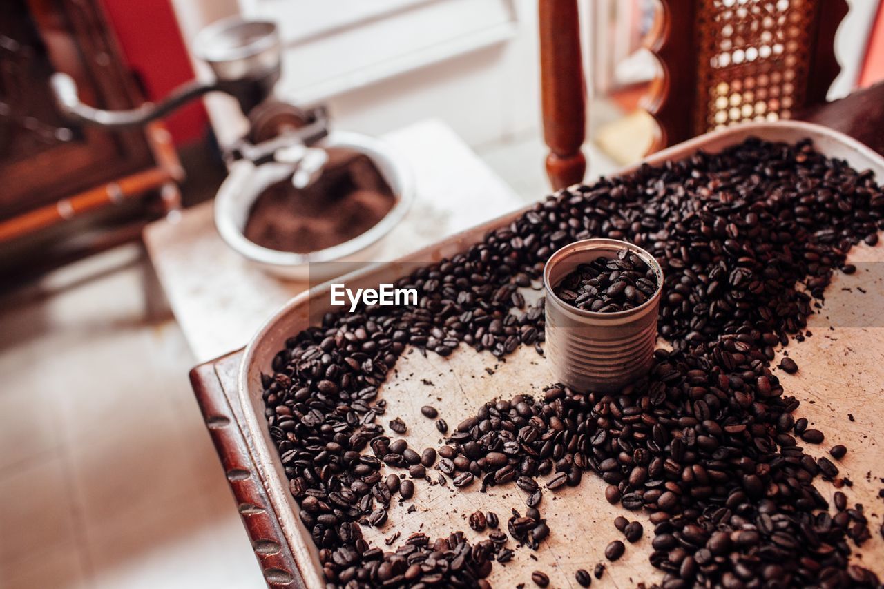 High angle view of coffee beans in tray on table