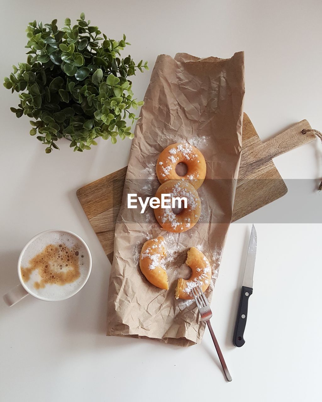 Directly above shot of donuts and coffee on table