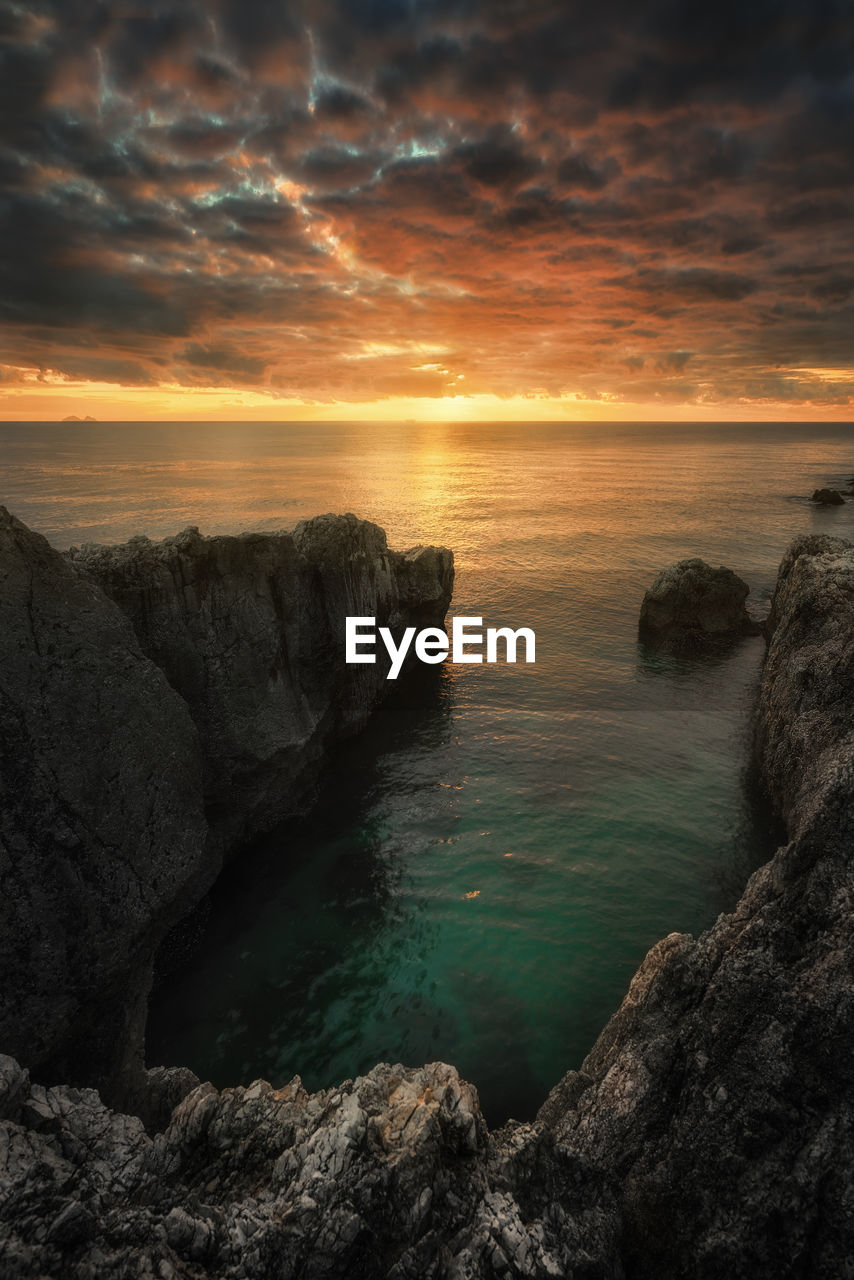 Scenic view of sea against sky during sunset