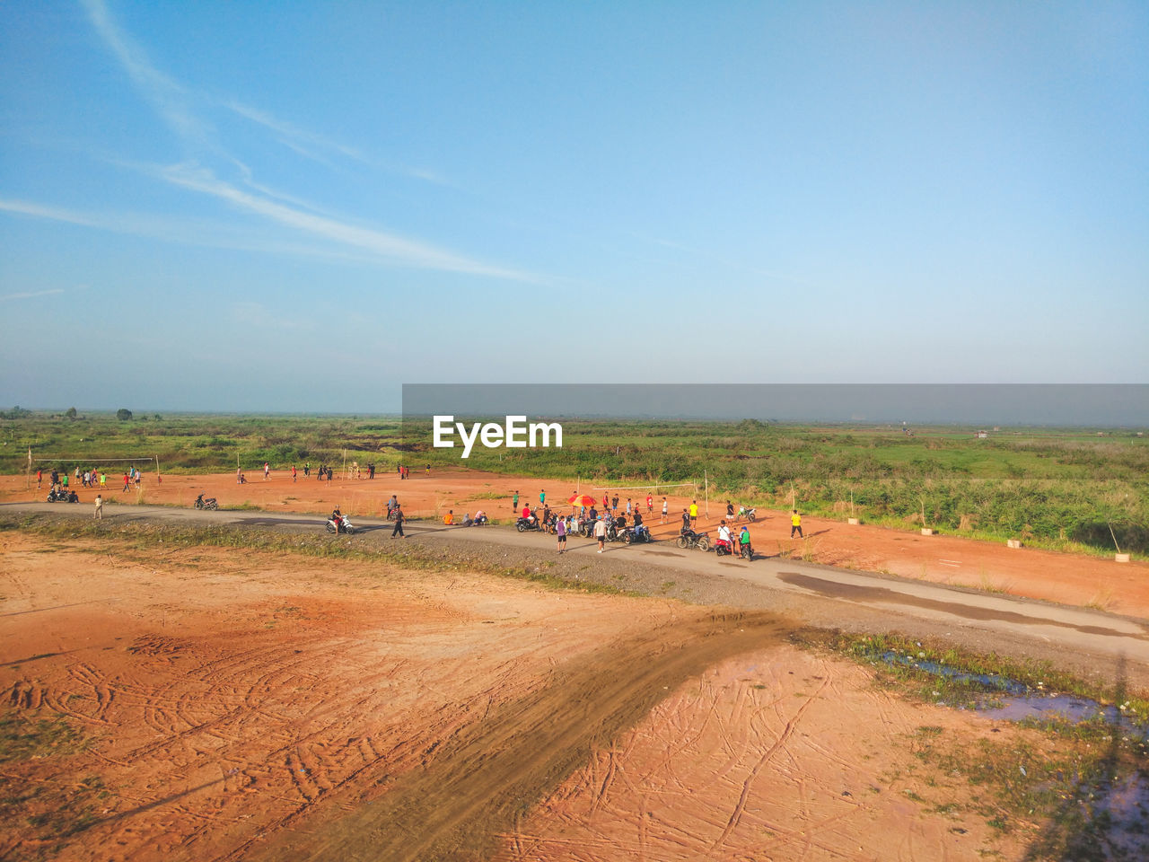 People on field against sky