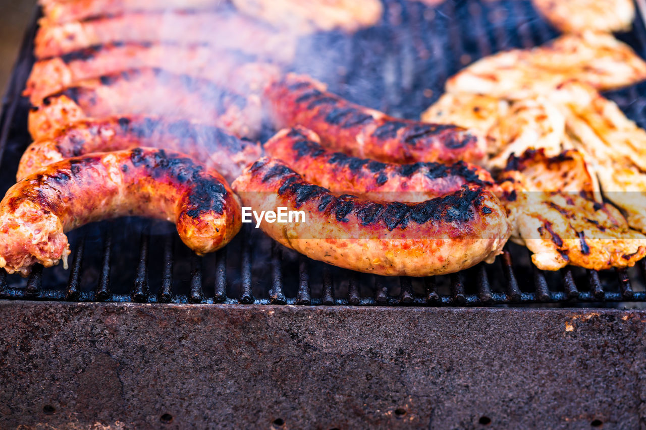 HIGH ANGLE VIEW OF MEAT ON BARBECUE