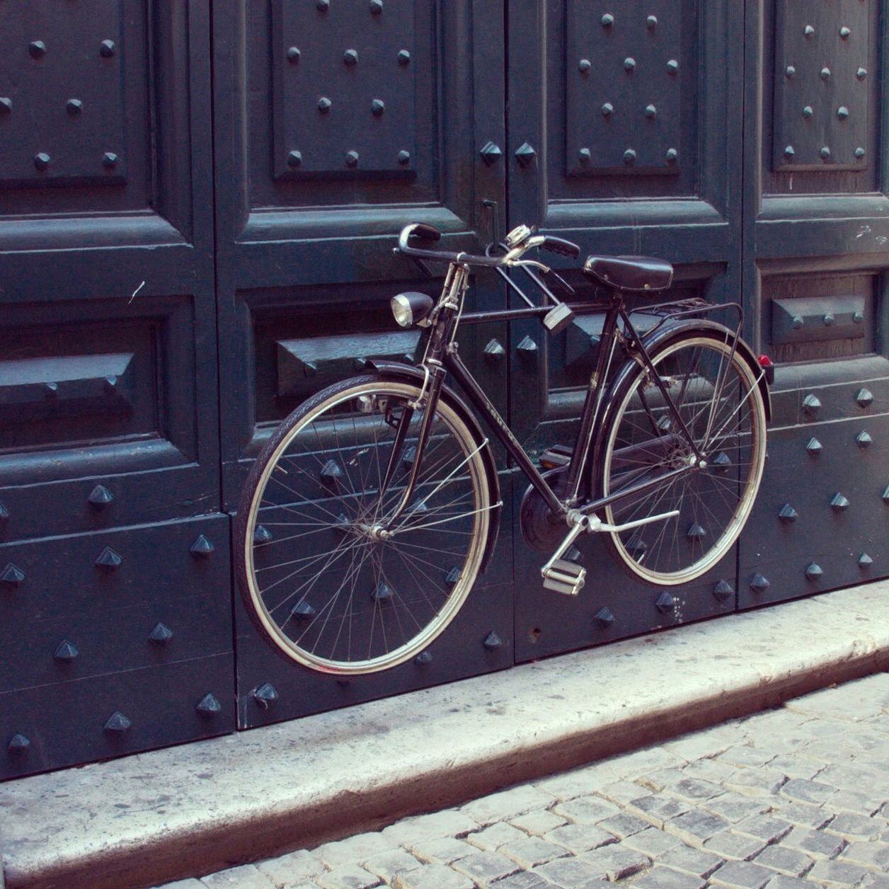 Bicycle locked to huge door