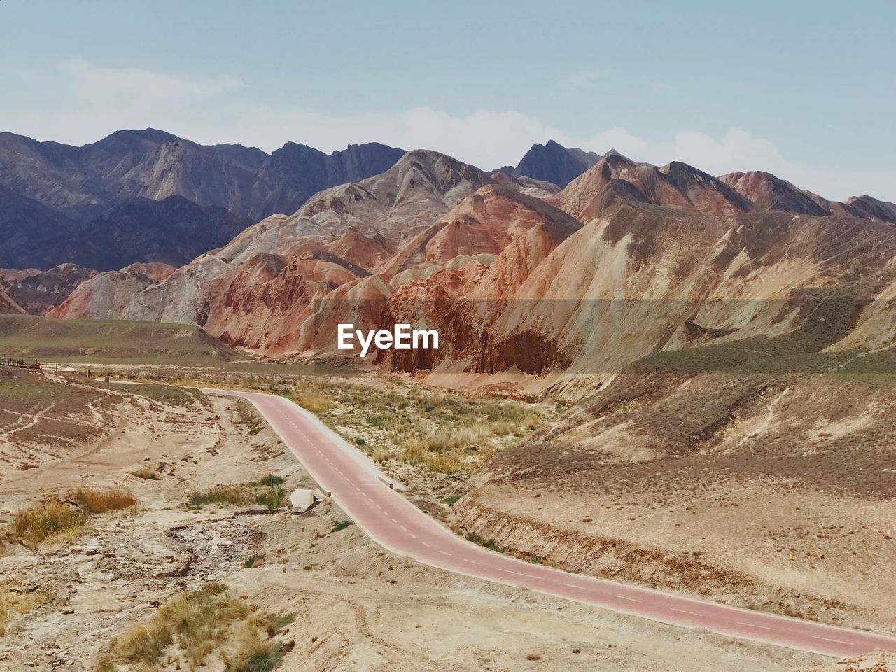 Scenic view of arid landscape against sky