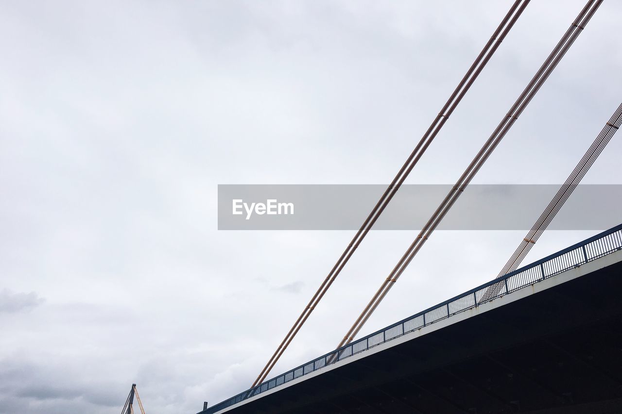 LOW ANGLE VIEW OF SUSPENSION BRIDGE