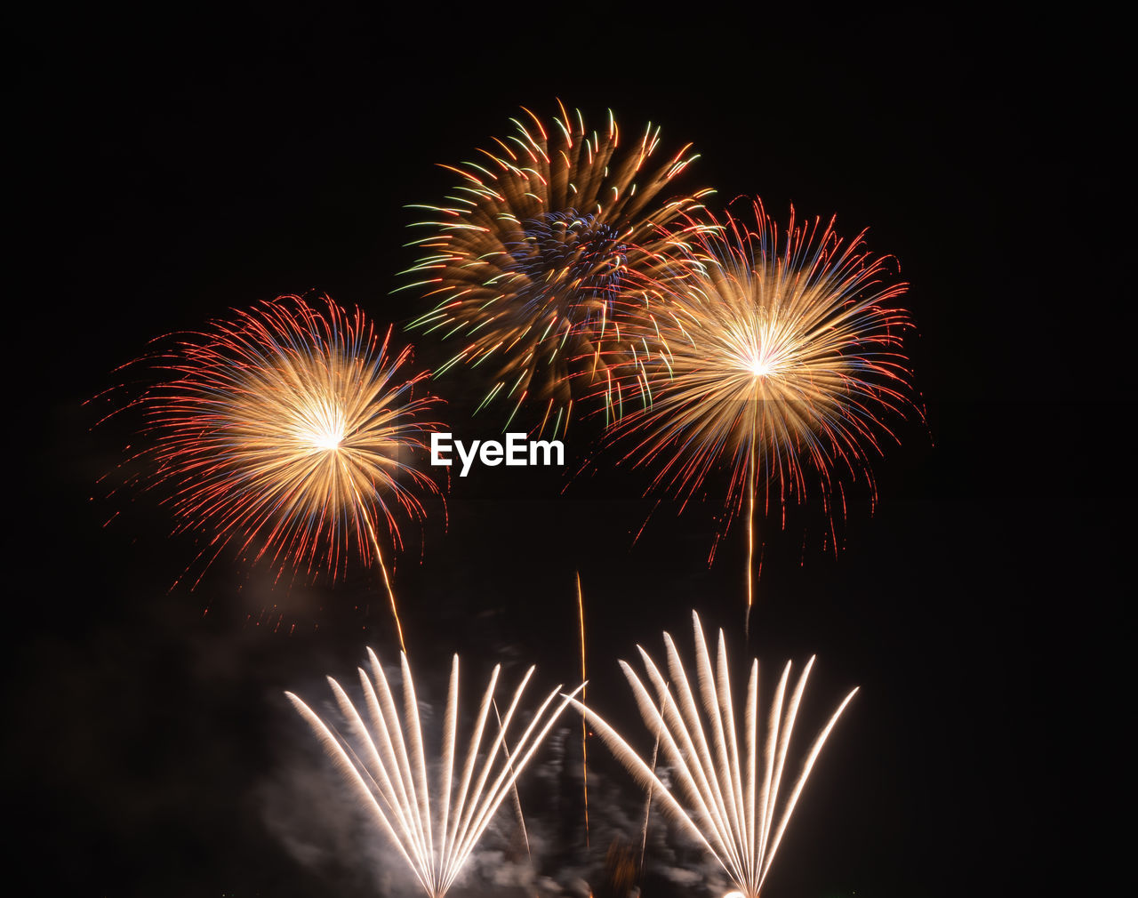 LOW ANGLE VIEW OF FIREWORK DISPLAY