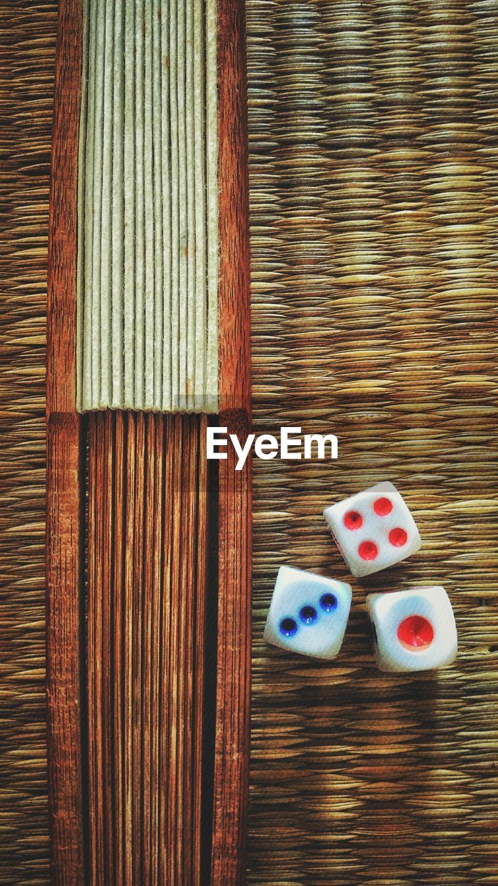 Directly above shot of dice on tatami mat