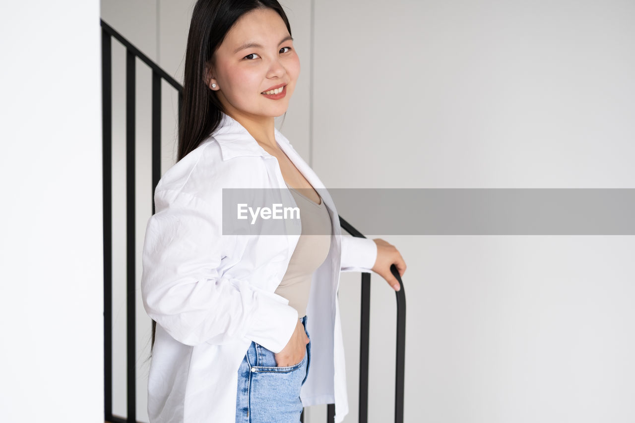 Portrait of smiling businesswoman at home