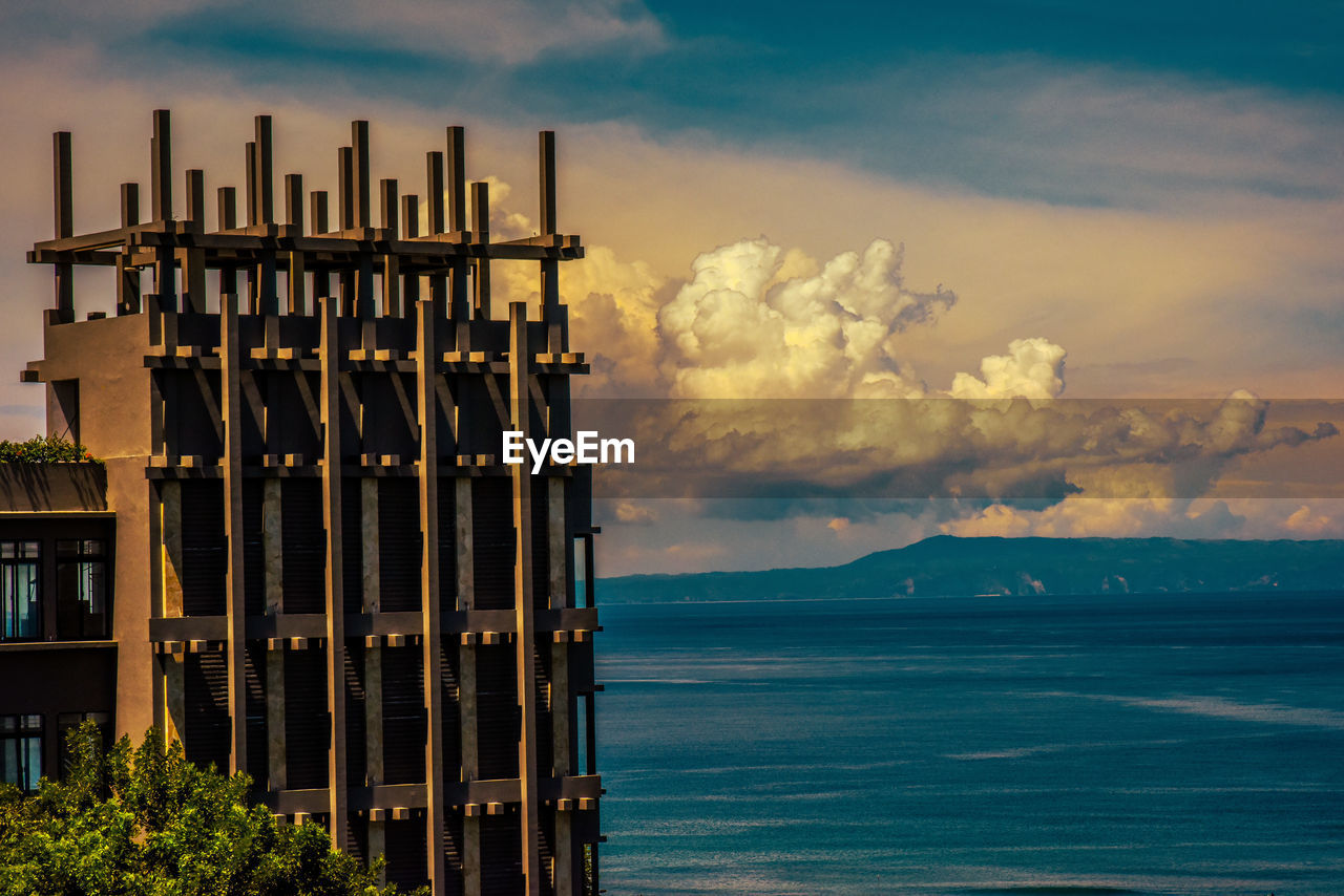 sky, water, cloud, sea, horizon, architecture, nature, dusk, ocean, evening, no people, built structure, land, beauty in nature, beach, scenics - nature, outdoors, reflection, sunset, tower, coast, building exterior, travel destinations, building