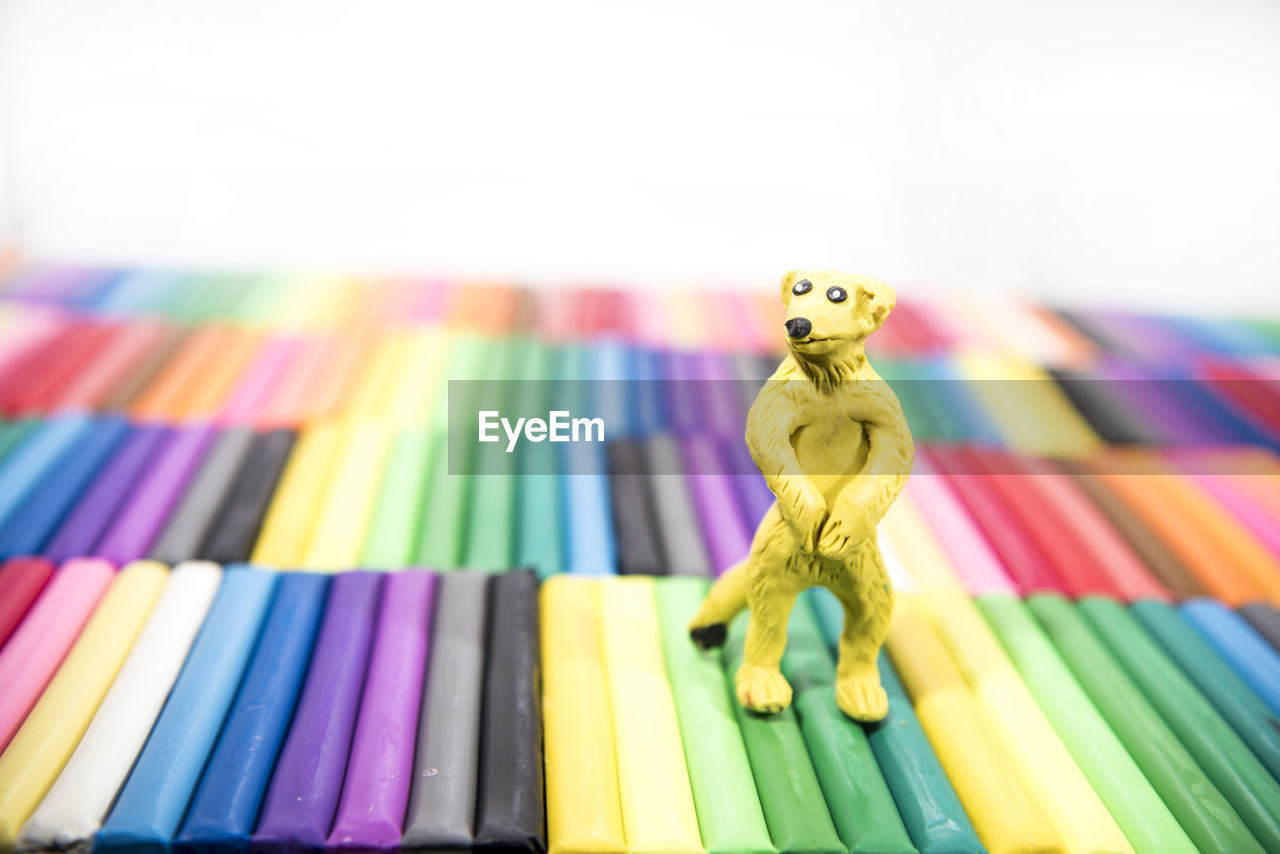 Close-up of toy on crayons