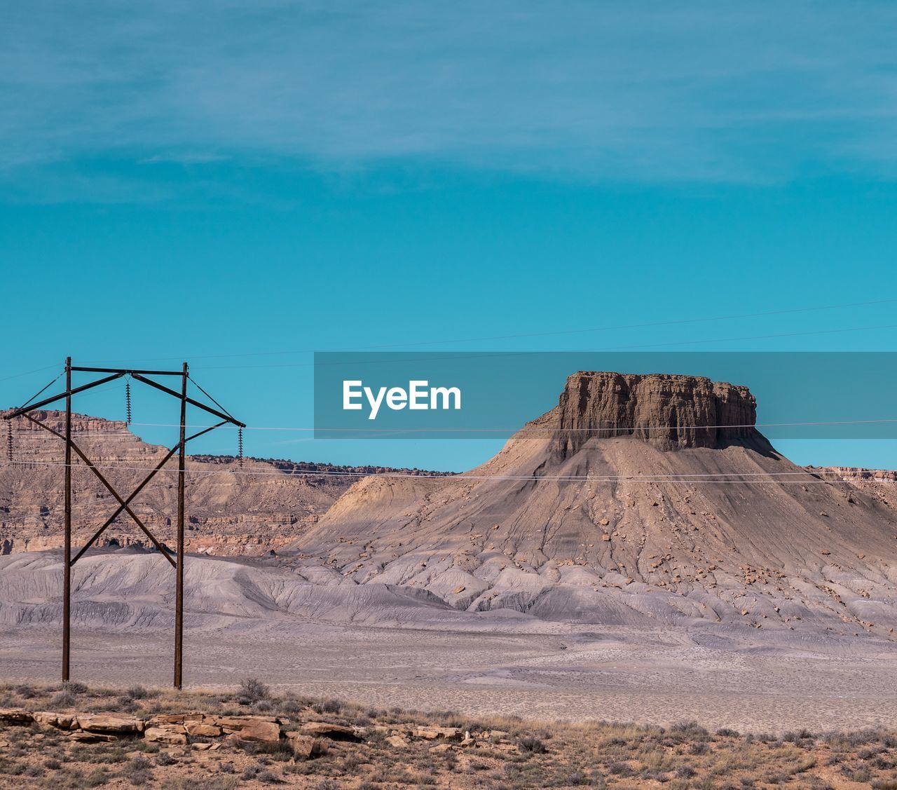 Rock formations in desert against blue sky