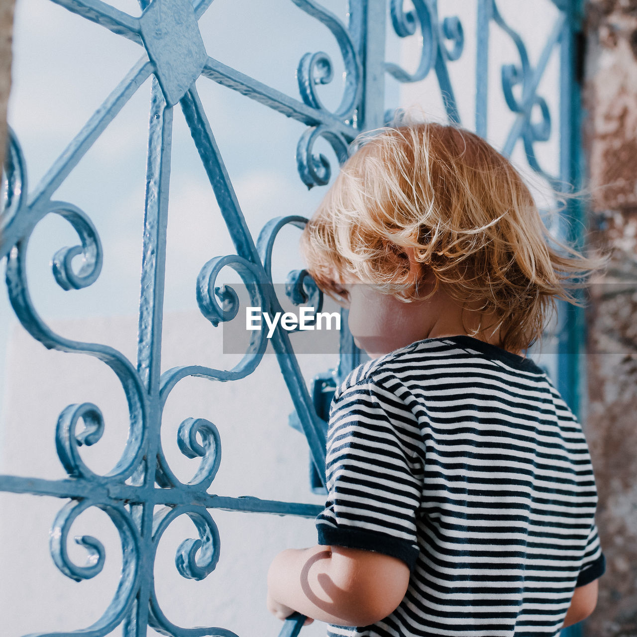 Boy looking towards window at home