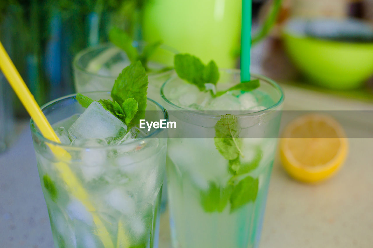 CLOSE-UP OF DRINK WITH GLASS OF TABLE