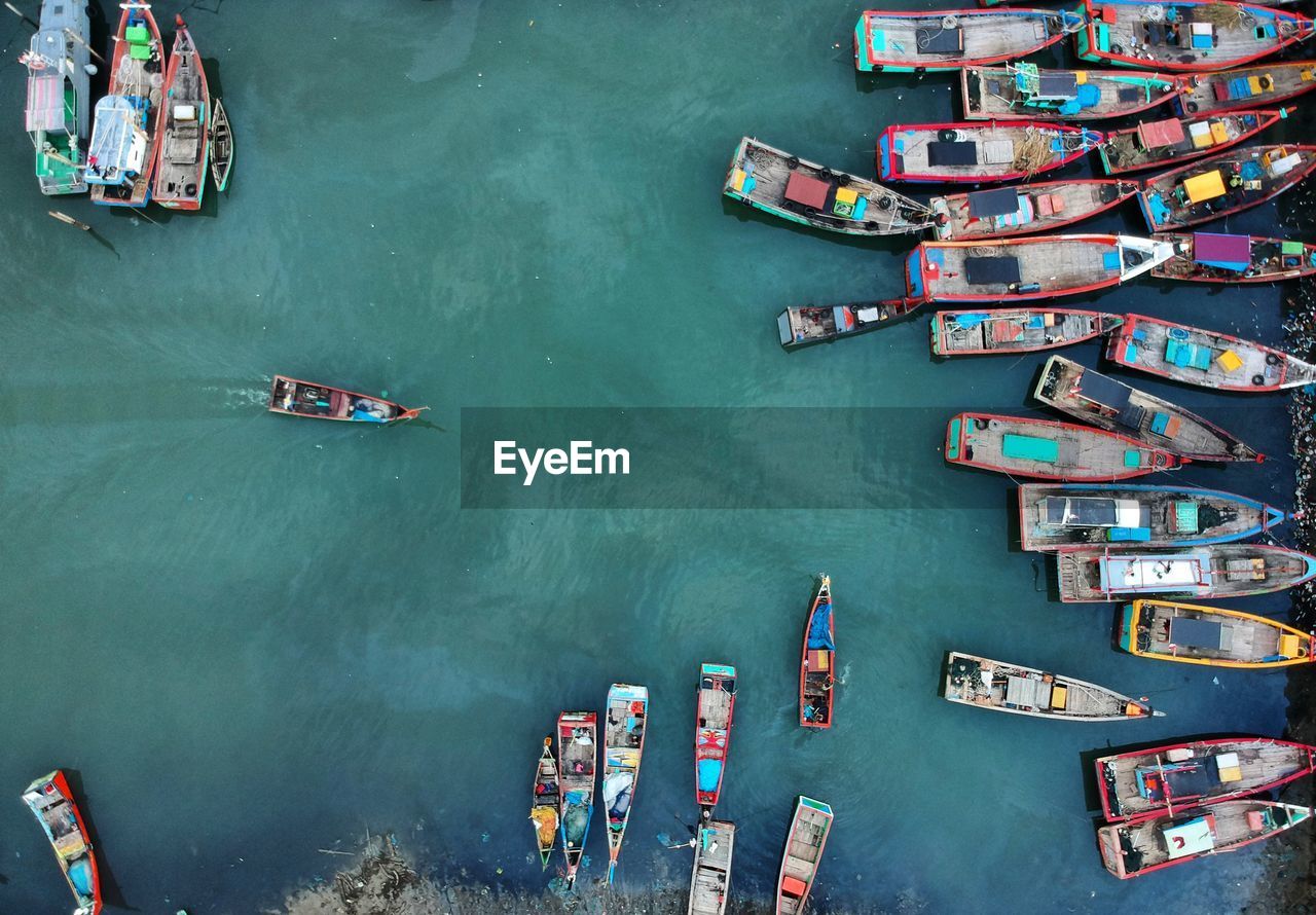 High angle view of boats moored in sea at harbor
