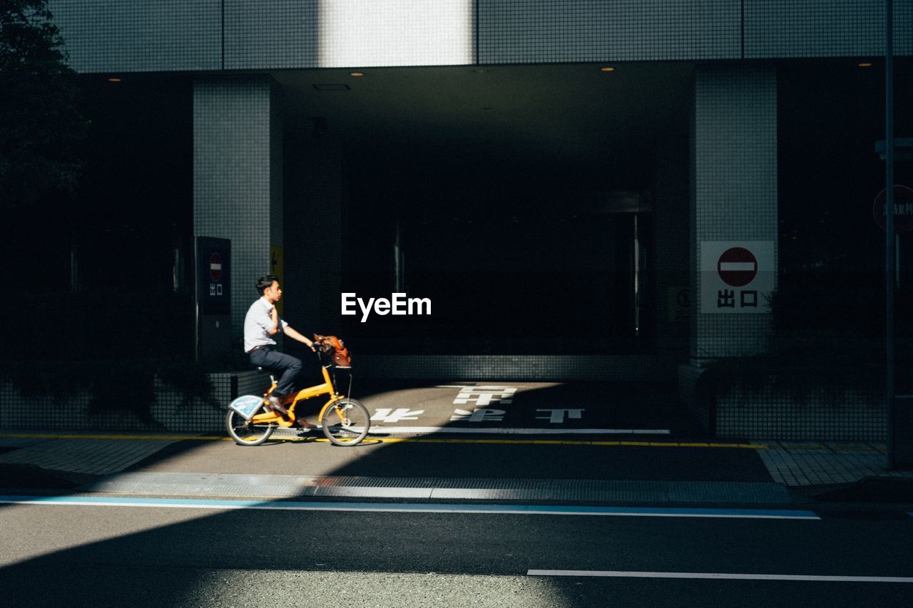 MAN RIDING MOTORCYCLE