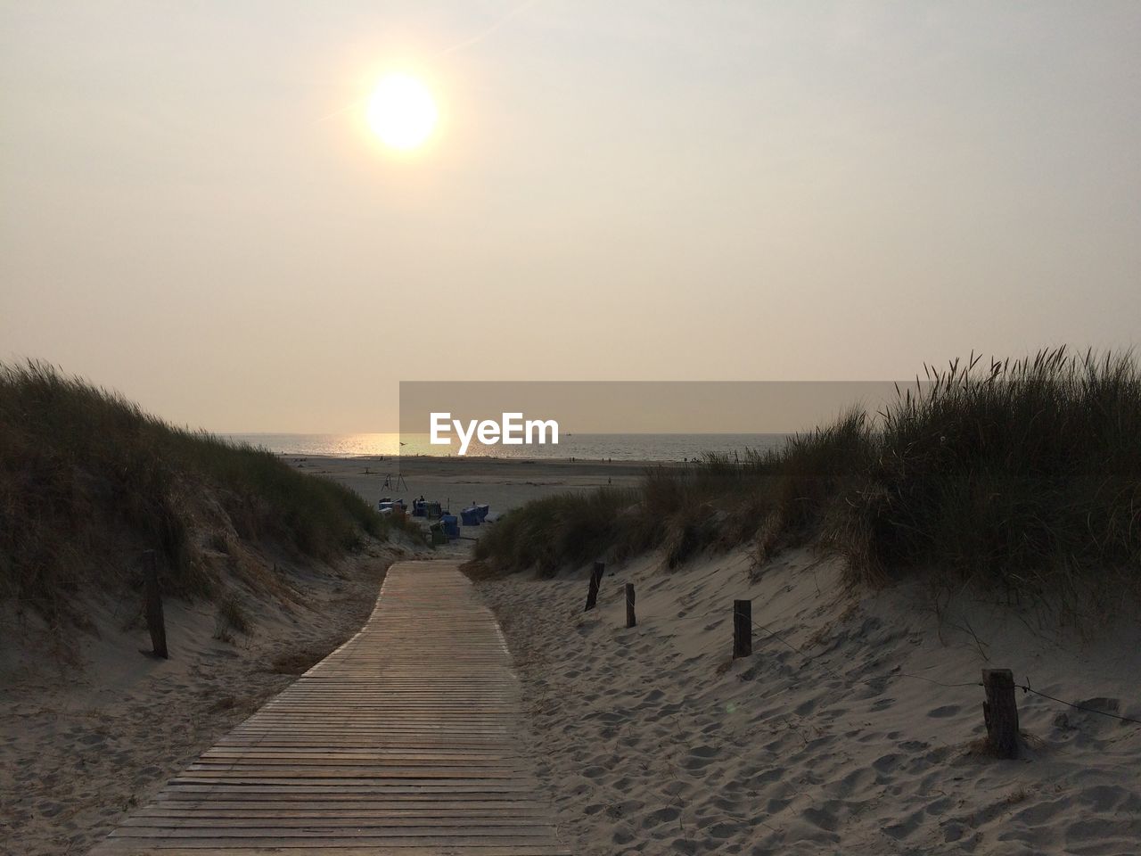 Scenic view of beach against sky during sunset