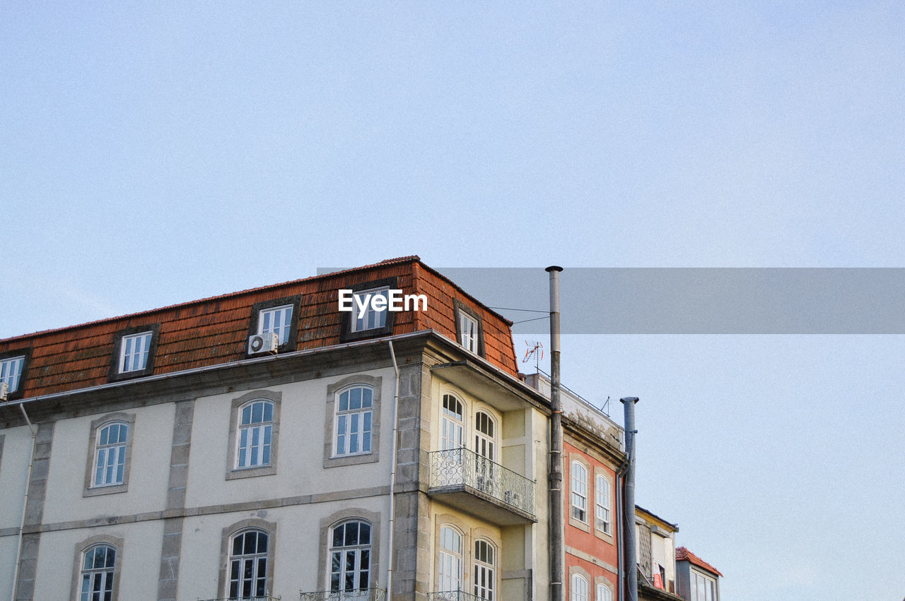 Low angle view of buildings against clear sky