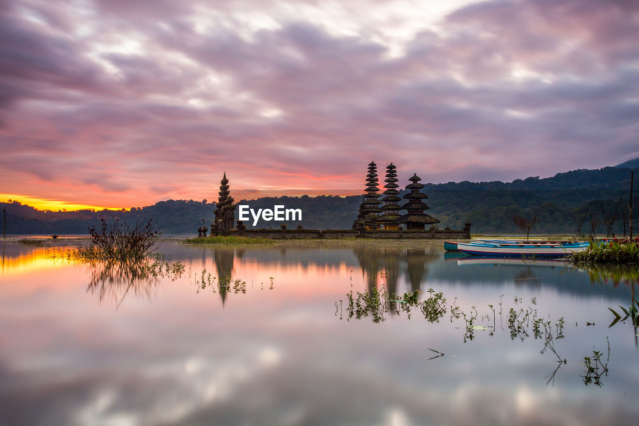 Scenic view of lake against sky during sunset