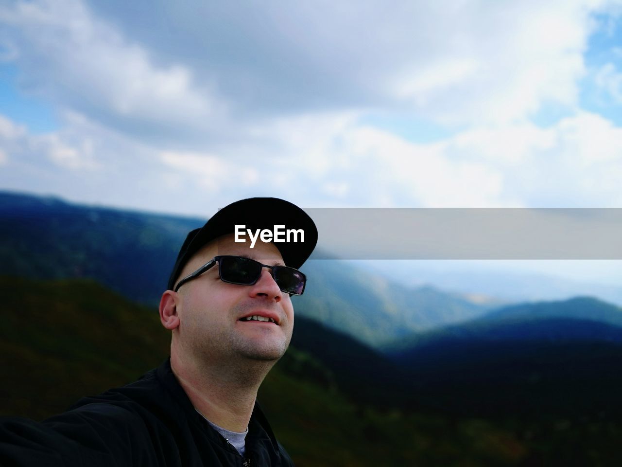 Man wearing sunglasses against sky