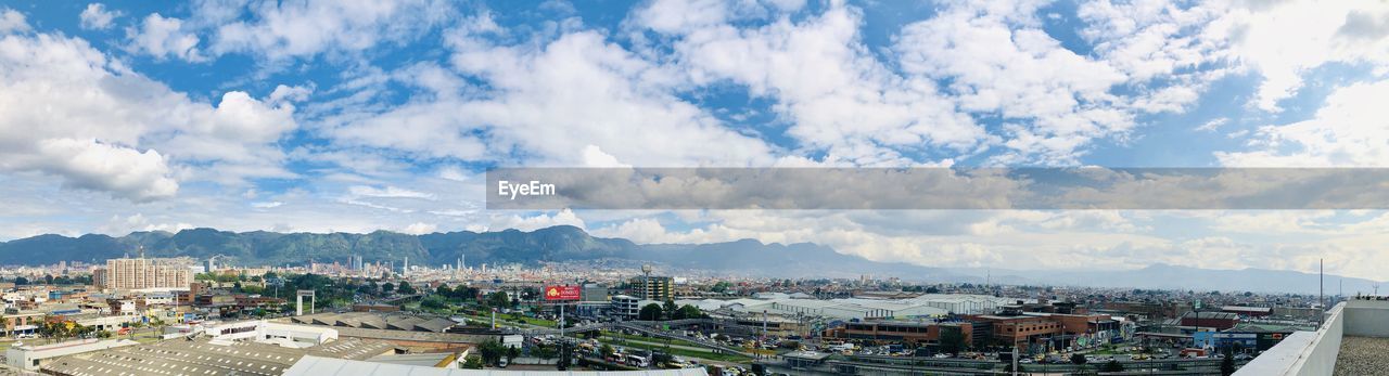 High angle view of townscape against cloudy sky