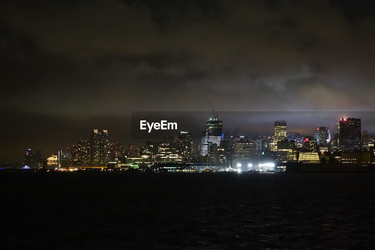 ILLUMINATED CITYSCAPE AT NIGHT