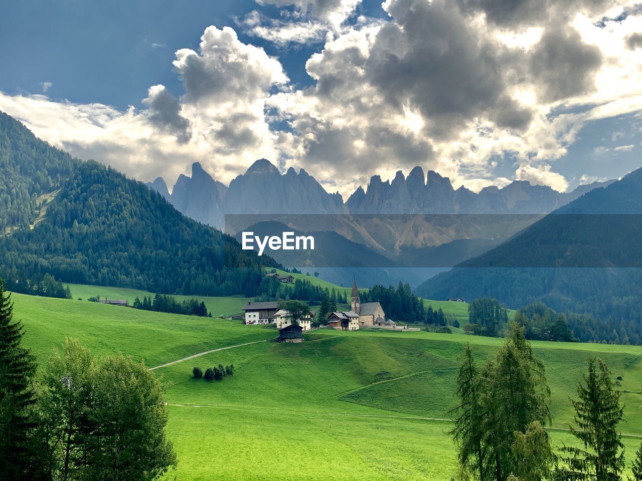 Scenic view of field and mountains against sky