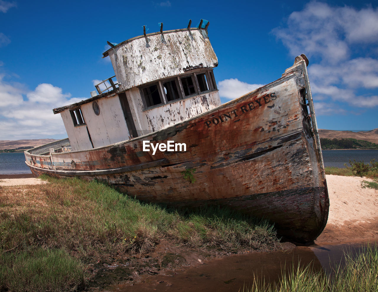 ABANDONED BOAT ON BEACH