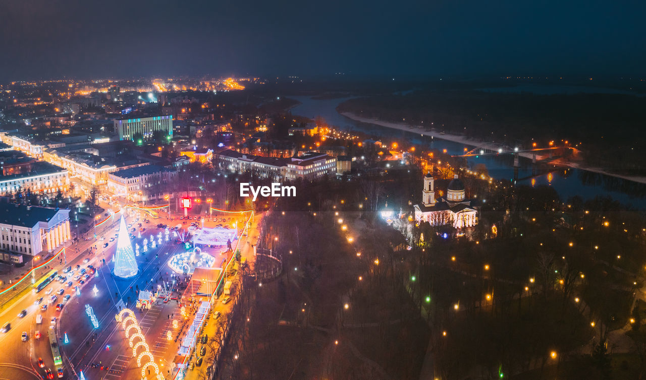 high angle view of illuminated city lit up at night