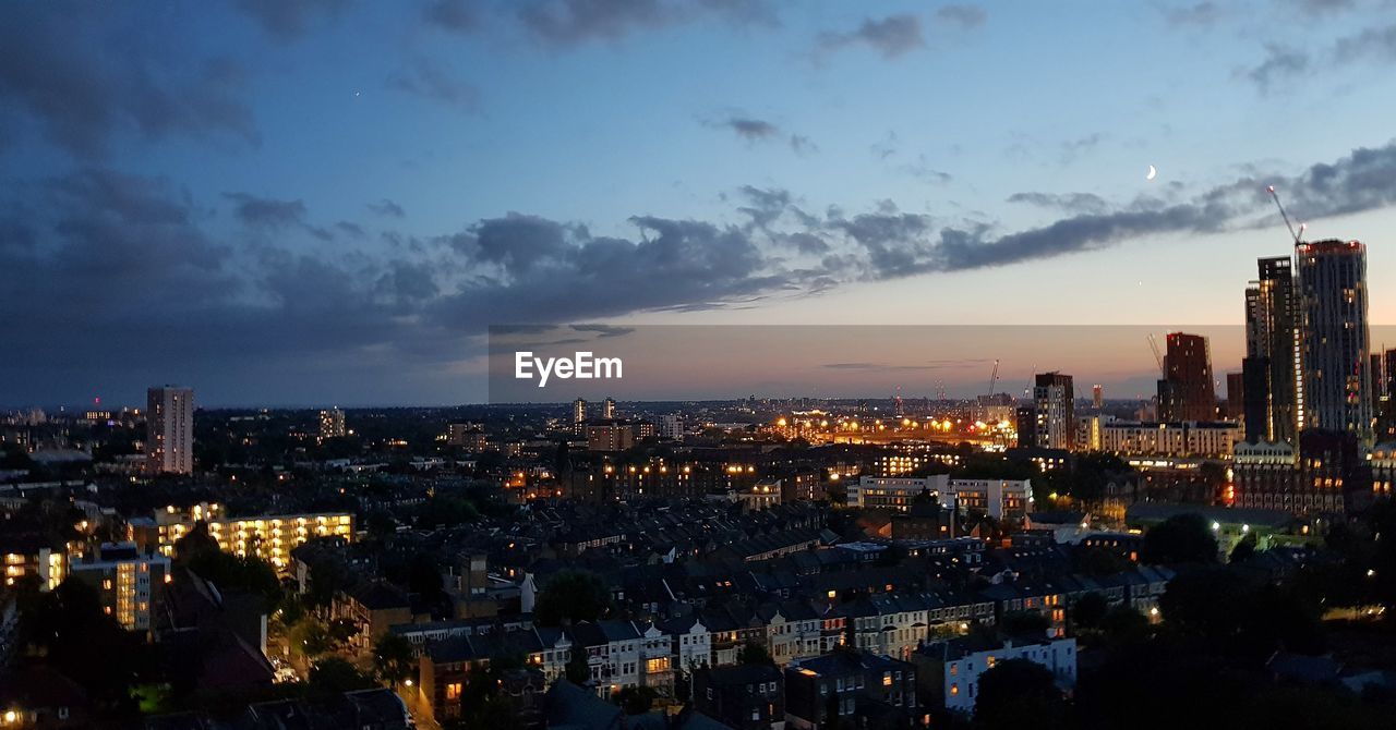 Aerial view of illuminated buildings in city