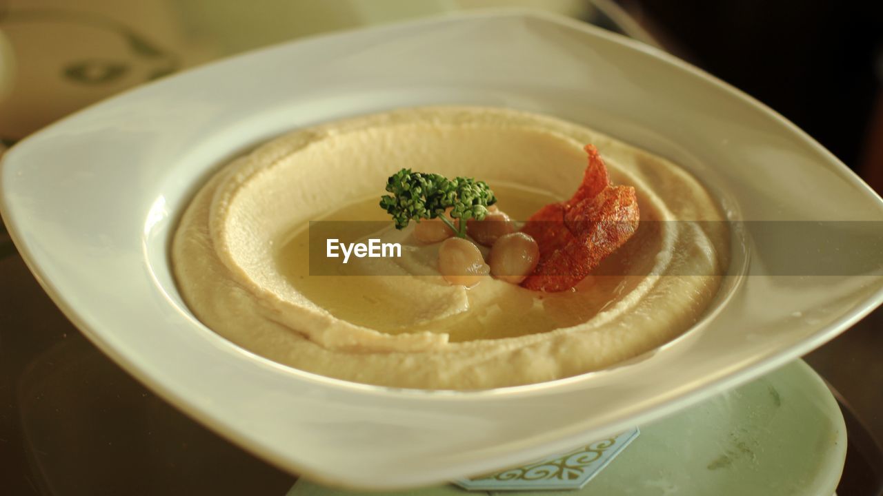 Close-up of hummus served in plate