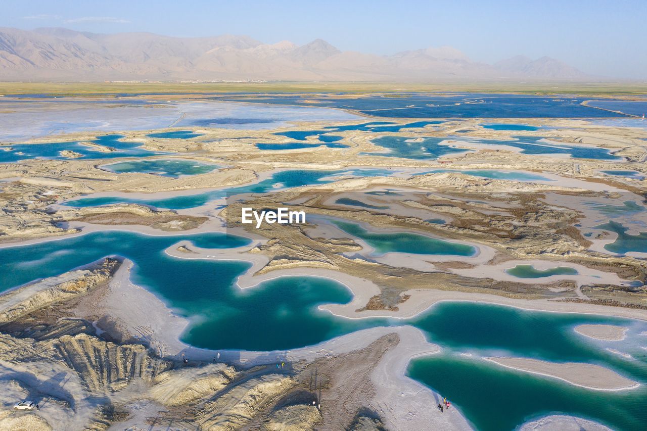 AERIAL VIEW OF LAKE AGAINST SKY