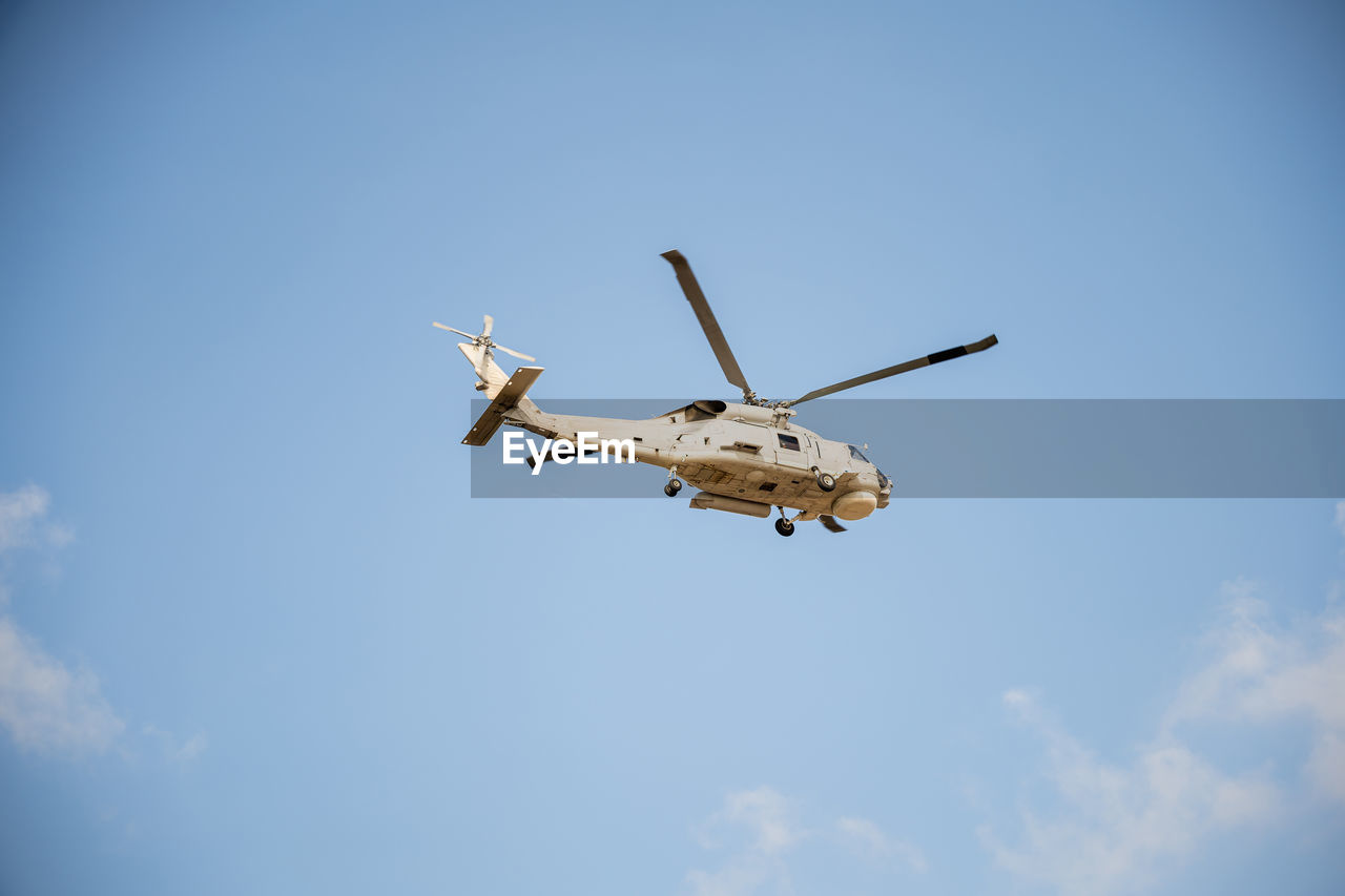 low angle view of airplane flying in sky