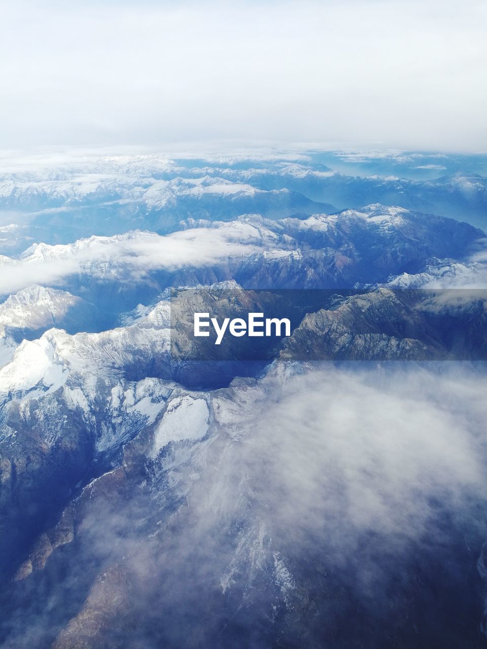 Scenic view of snow covered landscape against sky