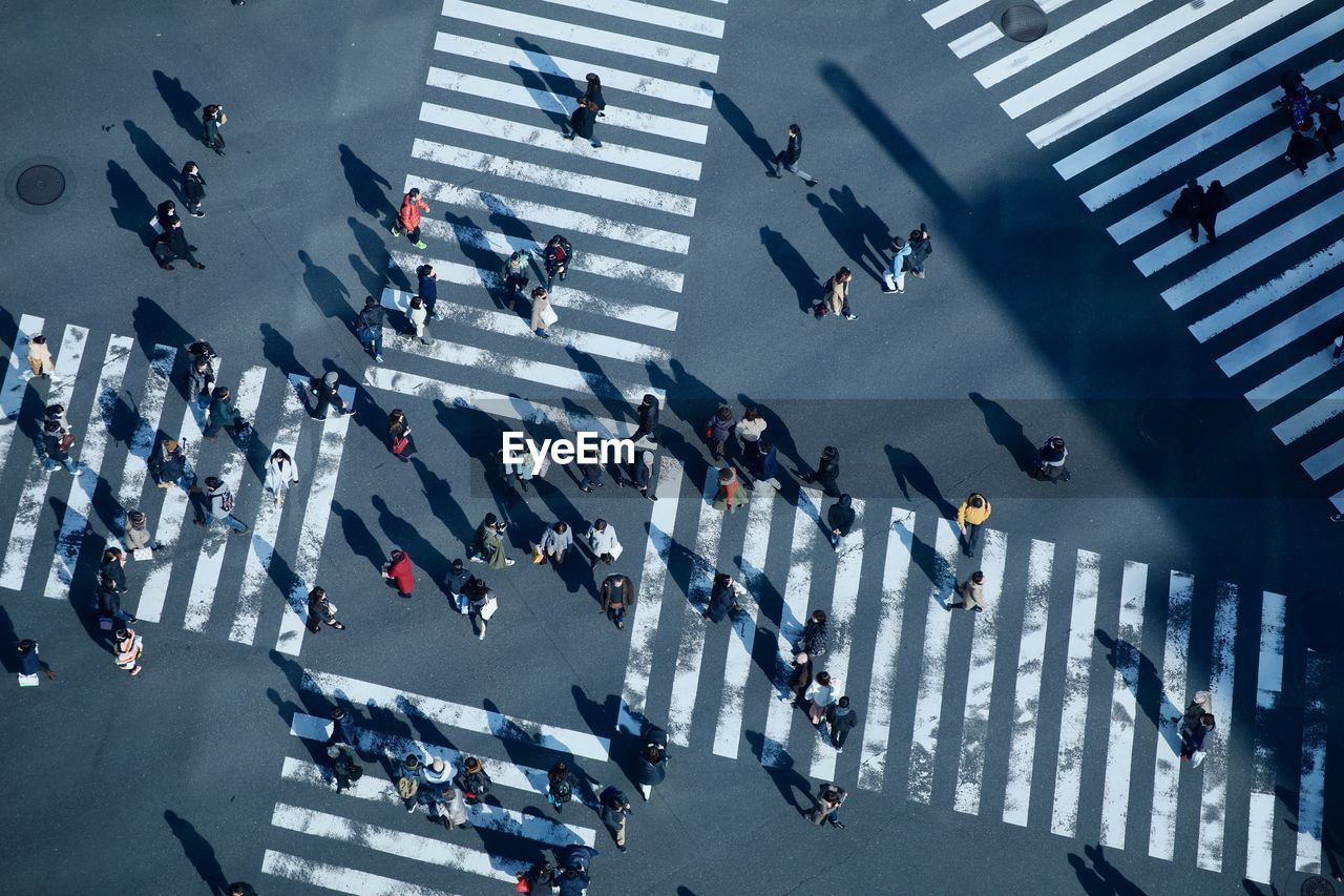 High angle view of people crossing road