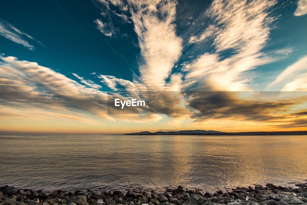 Scenic view of sea against sky at sunset