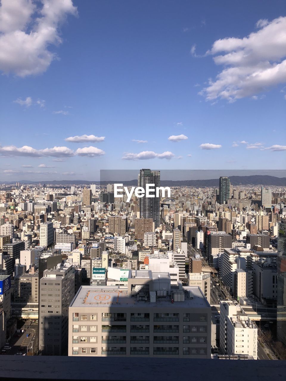 High angle view of buildings in city against sky