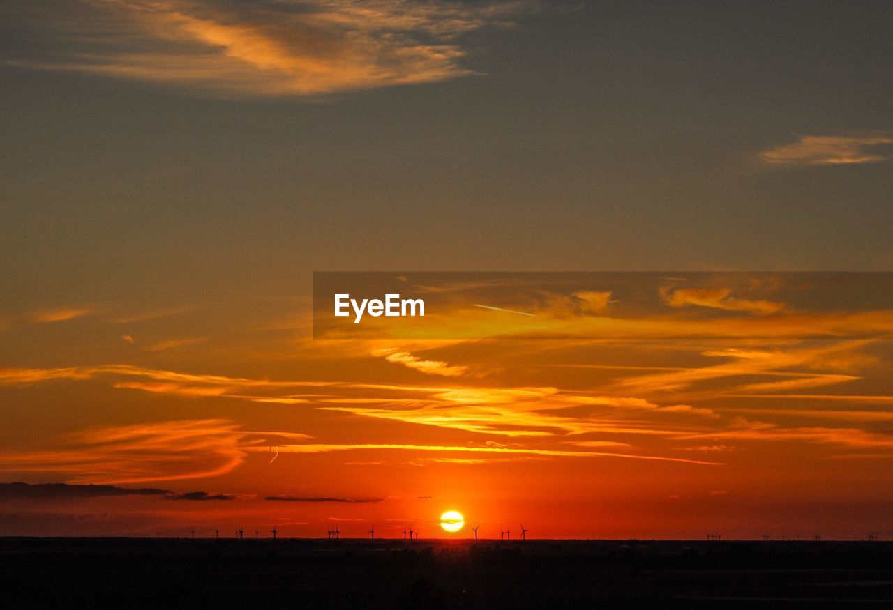 SCENIC VIEW OF SUNSET OVER SEA