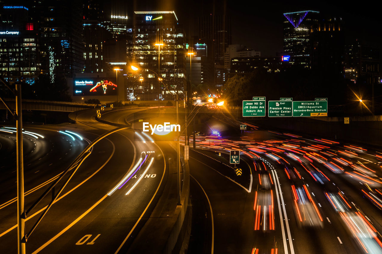 High angle view of light trails on road at night