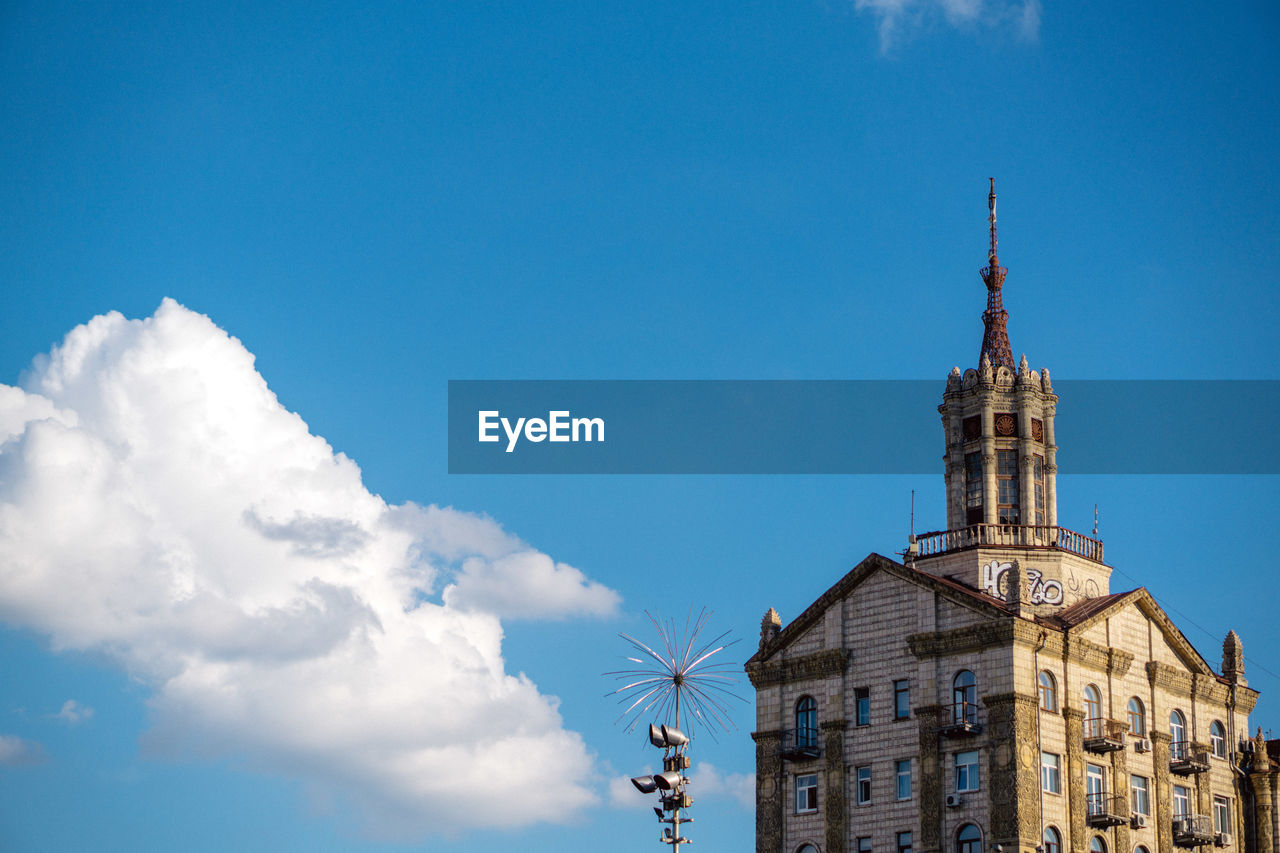 LOW ANGLE VIEW OF A BUILDING AGAINST BLUE SKY