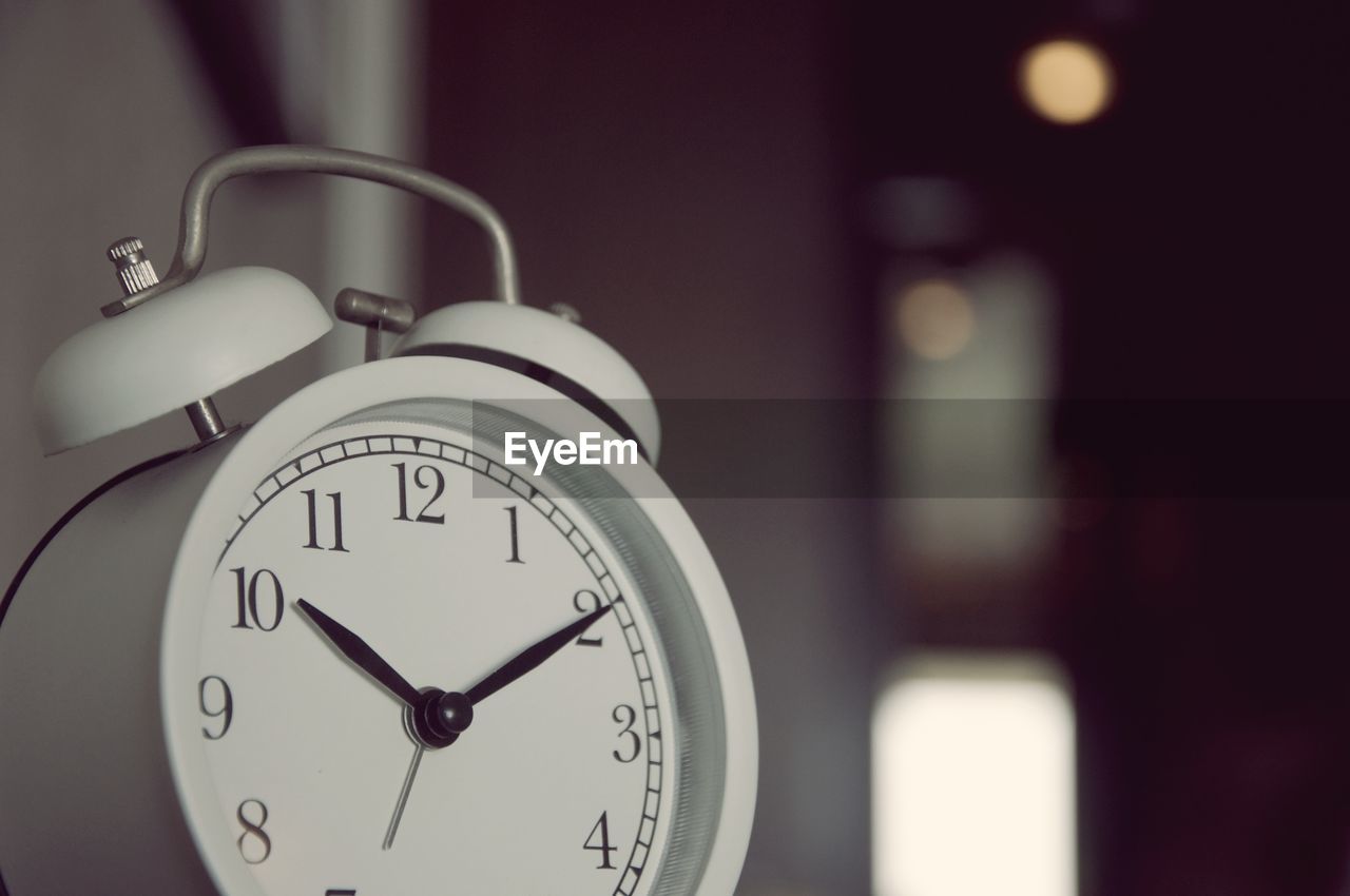 Close-up of alarm clock in living room 